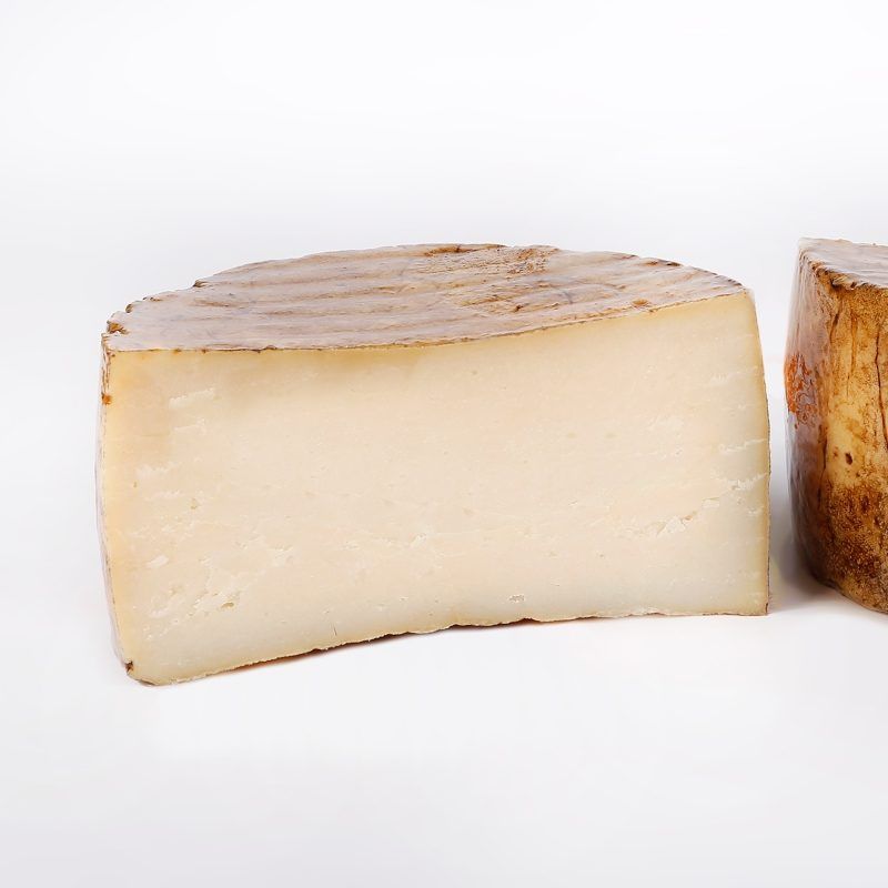 Queso de cabra curado con aceite de oliva virgen extra Queso de cabra curado con aceite de oliva virgen extra